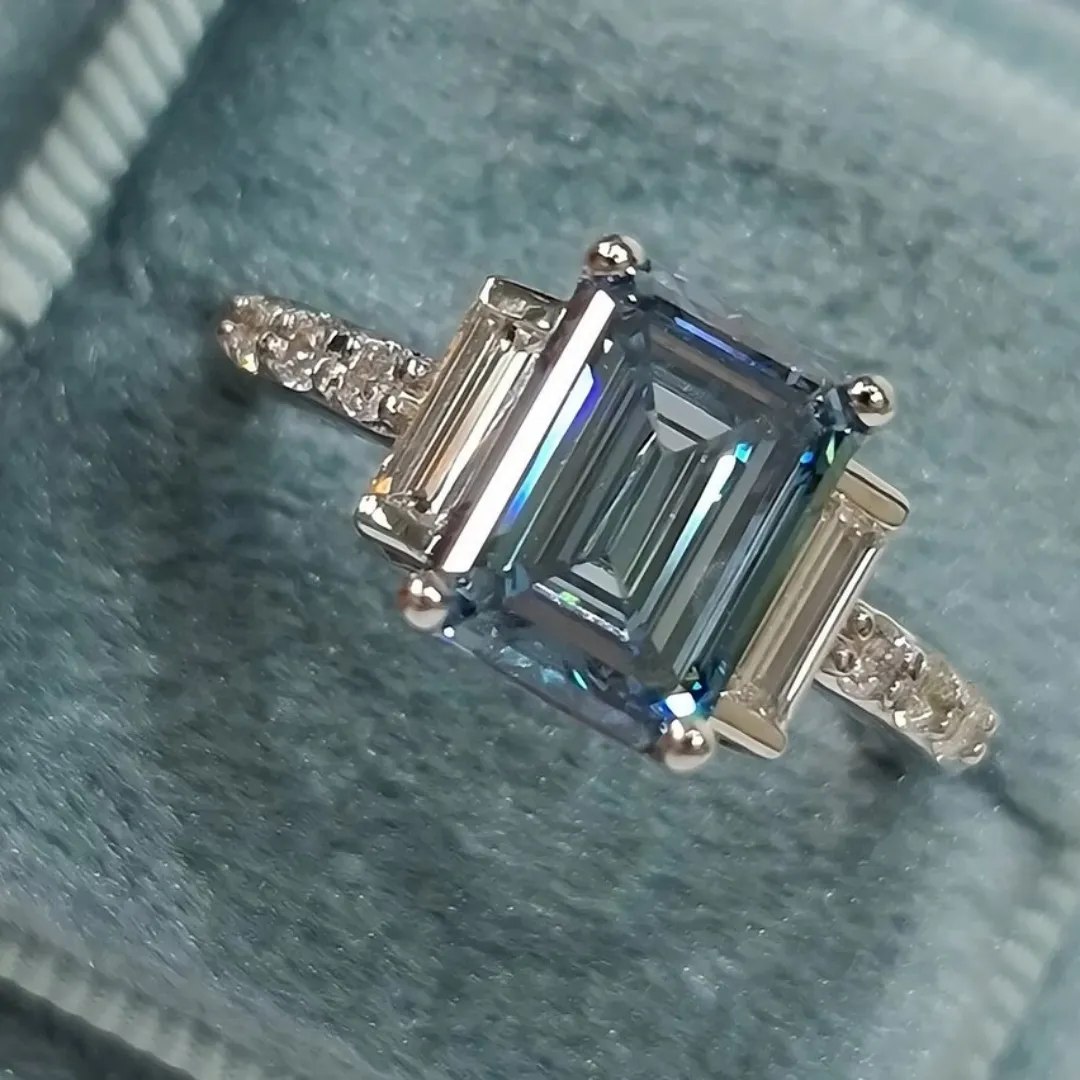 /public/photos/live/Blue Emerald Cut Moissanite Three Stone Engagement Ring 610 (3).webp